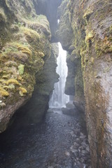 Obraz premium beautiful iceland waterfall with rocks and skies