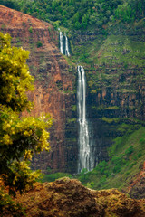 Waipo'o Falls, Waimea Canyon, Kauai, Hawaii. Waipo'o Falls is a fantastic waterfall on Kokee Stream dropping 800 ft. in two tiers. It is located in the heart of the Waimea Canyon.