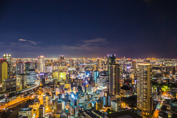 Aerial view of the Osaka cityscape at night from the observation platform at the Umeda sky building.