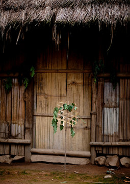 Hmong house with shaman warning sign, Muang sing, Laos