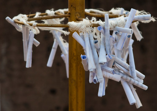 Papers to make wishes in a temple, Thakhek, Laos