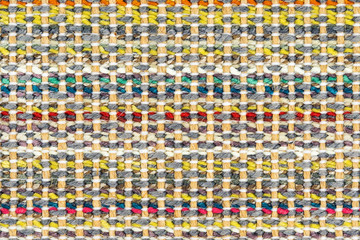 Multicolored knitted fabric background texture. Сolorful fabric with a pattern, Fragment colored wool carpet, bright wicker colorful rug