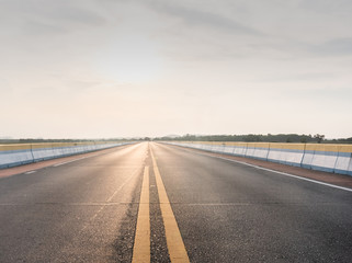 Asphalt road at beautiful sunset time.