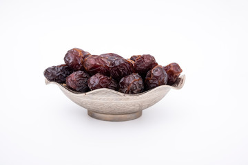 Organic dried dates, date fruit isolated on white