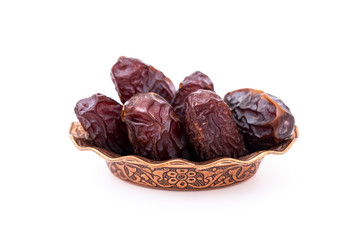 Organic dried dates, date fruit isolated on white