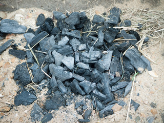 close up of black charcoal for fire on beach unlit