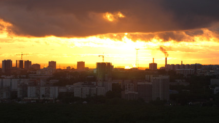 Sunset over city, close up on modern downtown Novosibirsk skyline buildings