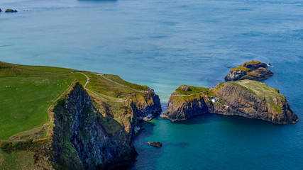Fototapeta premium Aerial view over Carrick-A-Rede Rope Bridge in North Ireland - travel photography