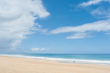Fototapeta na wymiar Hawaiian White Sand Beach, Polihale, Kauai, Hawaii. The seventeen mile stretch of white sand beach and sand dunes offer endless beach-combing and shelling fun.