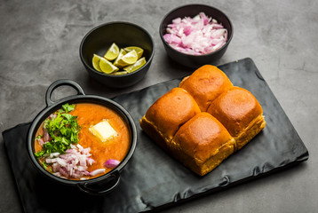 Indian spicy fast food / snacks Pav Bhaji with bread, onion and butter