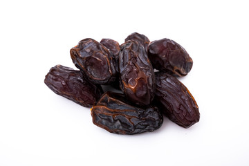 Heap of dried dates or date fruit isolated on white background