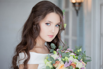 Beautiful elegant bride in white dress. A charming young woman is getting married.