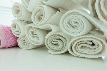 Obraz na płótnie Canvas roll up Hand towels on white table