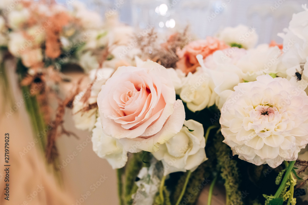 Wall mural gorgeous luxury wedding table arrangement, floral centerpiece close up. the table is served with cut