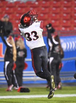 Football players making amazing playing during a football game