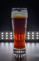 glass with red liquid, glass with ruby ​​beer