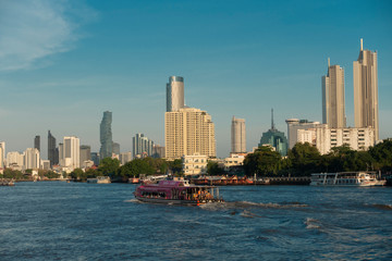 Fototapeta premium Beautiful cityscape views and ferry at the river in Bangkok thailand on April 24, 2019