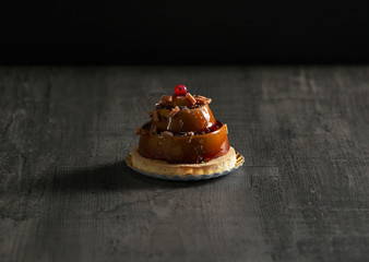 stylish beautiful caramel cake with berry on top