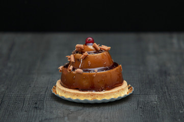 stylish beautiful caramel cake with berry on top