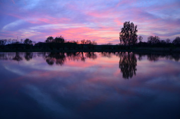 sunset on the lake reflection in water pacification  slackness  camping relaxation relaxationess