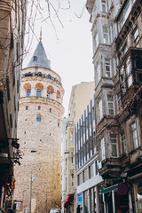 Fototapeta na wymiar street perspective. Galata tower and street in the old city of Istanbul, Turkey.