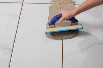 Process of grouting a floor