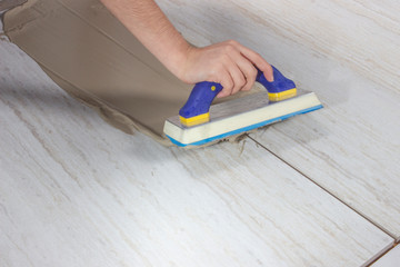 Process of grouting a floor
