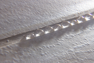 Process of sealing a grout