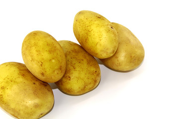 Young potatoes clean on white background, five pieces