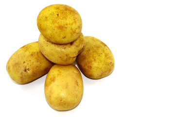 On three large potatoes are two potatoes smaller, white background