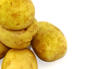 Five young and fresh potatoes on a white background