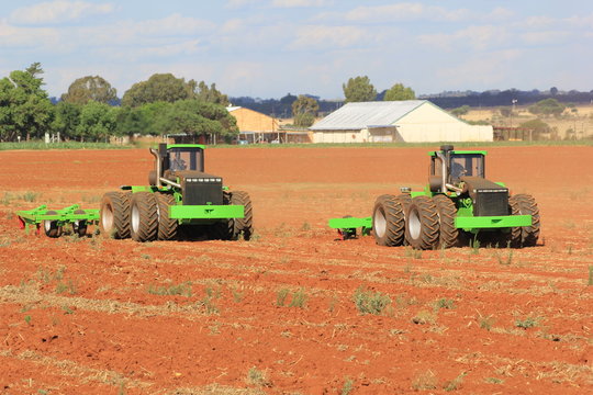 Two articulated Agrico tractors ripping field near Lichtenburg in South Africa
