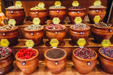 A variety of culinary seasonings in the eastern market. Bright and colorful tea shelves from the...