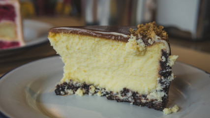 Cheesecake with caramel on the plate close-up.