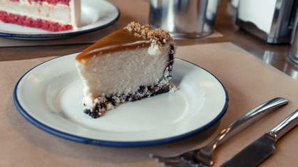 Cheesecake with caramel on the plate close-up.