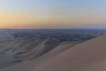 Fototapeta na wymiar sunset at huacachina desert oasis in peru