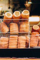 The most popular dessert in Prague. Grilled food. Manufacturer trdelnikov in Prague. Selective focus