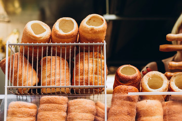 The most popular dessert in Prague. Grilled food. Manufacturer trdelnikov in Prague. Selective focus