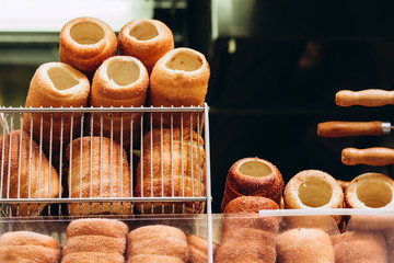 The most popular dessert in Prague. Grilled food. Manufacturer trdelnikov in Prague. Selective focus