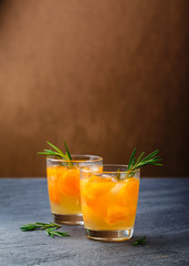 Fototapeta premium Summer drinks, rosemary aprcot cocktails.