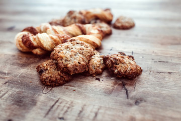 Cookies on a rustic wooden table. Homemade cookies with nuts and dried fruit. Top view flat lay background. Space for text. cookies on wooden table background