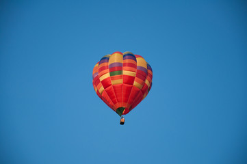 Big balloon. Balloon. Colorful bowl with basket. In the sky soars in the summer	