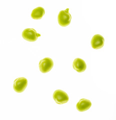 Green pea seeds (chícharos, petipuas), tender and very fresh (with drops of water). Isolated on white background.