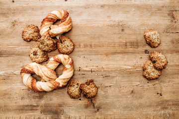 Cookies on a rustic wooden table. Homemade cookies with nuts and dried fruit. Top view flat lay background. Space for text. cookies on wooden table background