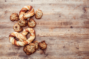 Cookies on a rustic wooden table. Homemade cookies with nuts and dried fruit. Top view flat lay background. Space for text. cookies on wooden table background