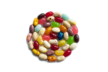 Brightly colored candy beans. Colourful jelly bean background. Jelly beans isolated on white background.