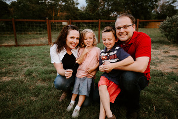 Happy family playing with sparkler fireworks together