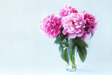 bouquet of pink peonies in a vase on the table close-up. flower card with a bouquet of  flowers.
