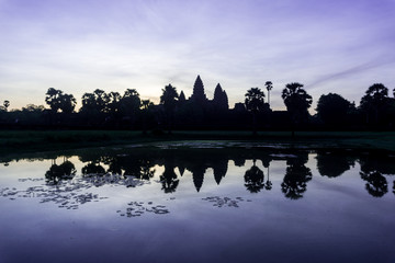 A beautiful sunrise in the ancient temple complex of Angkor Wat, Cambodia, one of the largest religious monuments in the world.