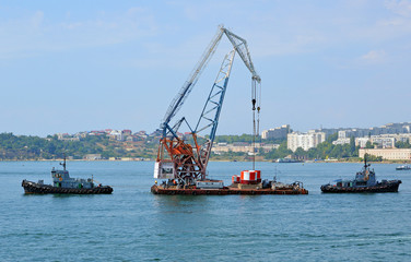 Installation of buoys denoting the parking of ships in the port water area in Sevastopol